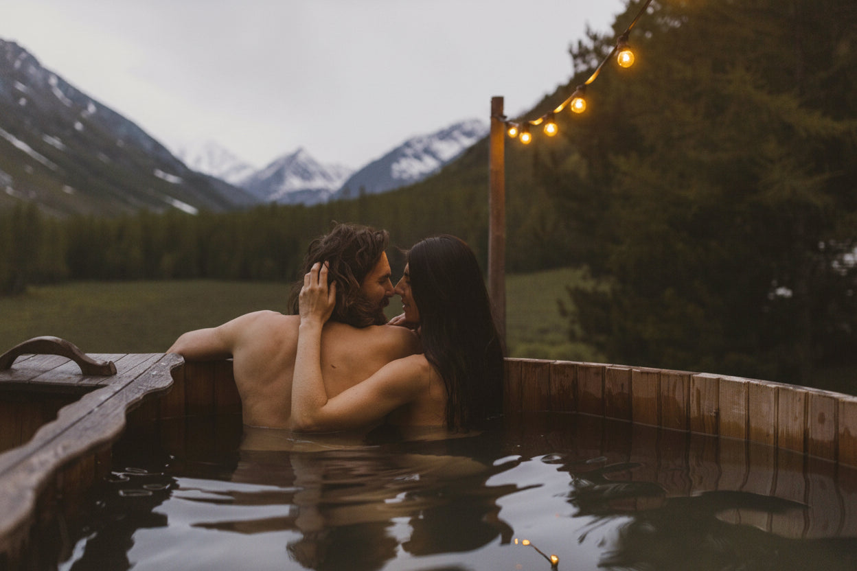 wood-fired-hot-tub-couple-relaxing-outdoor-mountain-view